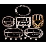 Six assorted silver buckles and garter buckles,