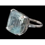 A cushion-shaped blue topaz single-stone ring: the pale blue topaz 21mm long x 19.