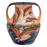 A limited edition Moorcroft pottery two handled vase: tubelined after a design by Philip Gibson