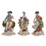 A pair of Derby bocage figures of the Seasons and a similar figure of a sportsman: Summer holding a