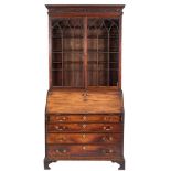 A George III mahogany bureau bookcase:,