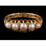 An 18ct gold and seed pearl mounted five-stone ring: in claw setting,