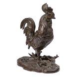 A Continental bronze inkwell in the form of a cockerel: the hinged head with glass inset eyes