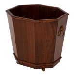 A mahogany octagonal jardiniere in the Regency taste:,