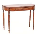 An early 19th Century mahogany tea table: of D-shaped outline, the hinged top with a reeded edge,