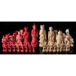 A late 19th century Chinese export ivory Mandarin pattern chess set: one side stained red,