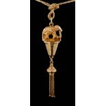 An elephant motif pendant with tassel drop and on curb-link chain,:approximately 20gms gross weight.
