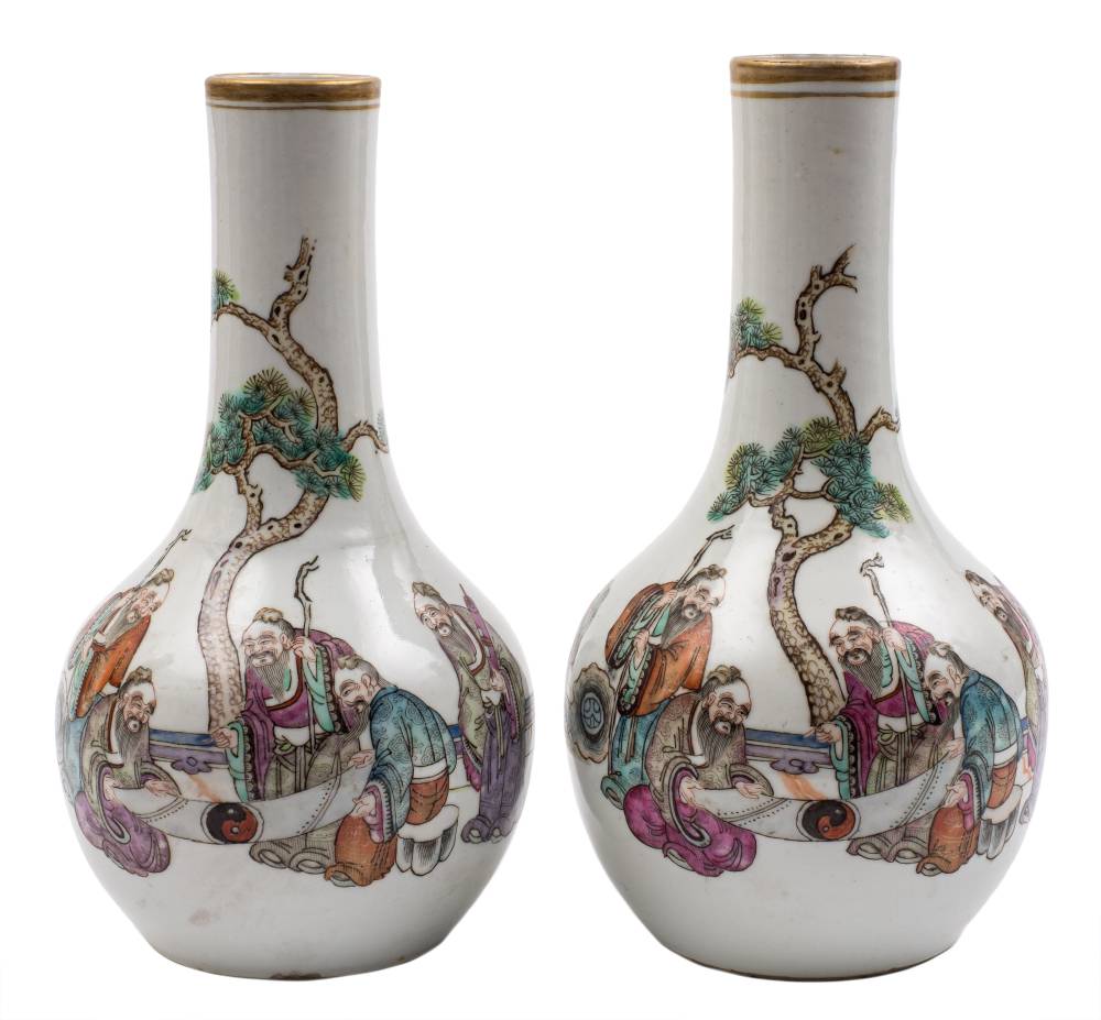 A pair of Chinese famille rose bottle vases: each painted with a group of five scholars in an