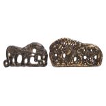Two Chinese bronze buckles: one decorated with a horse-drawn cart,