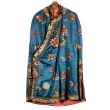 An early 20th century Chinese silk cape: the collar embroidered with butterflies and flowerheads,