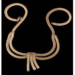 A 9ct gold necklace centring a triple tassel drop: on bolt ring clasp,