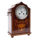 An Edwardian French mantel clock: the eight-day duration movement striking the hours and half-hours