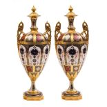 A pair of large Royal Crown Derby two-handled vases and covers: in the 'Old Imari' pattern with