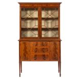An Edwardian mahogany and inlaid display cabinet:, in two sections, crossbanded in satinwood,