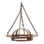 An Arts and Crafts copper light fitting: the circular corona suspended from rectangular linked