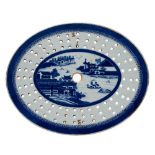 A Chinese blue and white oval crested meat strainer dish: painted with a panel of pavilions in a