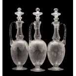 A set of three Webb Corbett 'crystal' glass claret jugs and stoppers retailed by Royal Doulton: in