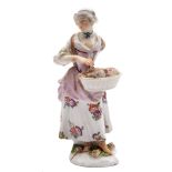 Two Meissen figures: the first of a shepherdess, wearing a yellow bodice,