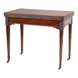 An Edwardian mahogany triple top folding games table:,