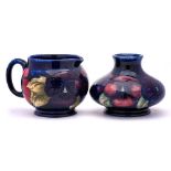 A Moorcroft pottery small vase and jug: of squat form and each tubelined in the Pansy pattern