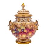 A Royal Worcester pot-pourri vase and cover: painted with peaches and grapes on a mossy ground,