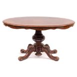 A Victorian walnut oval breakfast table:,