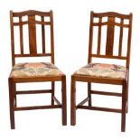 Heal & Son, London W A pair of Edwardian oak dining chairs:,