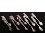 Four Irish and one English silver pairs of sugar tongs,