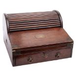 A 19th century mahogany brass bound tambour topped campaign writing slope: the domed reeded tambour