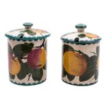 Two Wemyss pottery preserve jars and covers: of cylindrical form,