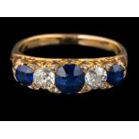 A sapphire and diamond five-stone ring: with graduated, oval sapphires and round old,