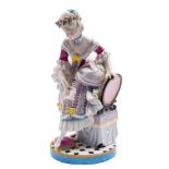 A pair of French porcelain figures of Cinderella and her Prince: wearing eighteenth century costume,