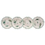 A set of four Wedgwood feather edged creamware plates: transfer printed and painted in green