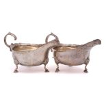 A pair of Victorian silver sauce boats, maker Charles Stuart Harris, London, 1888: crested,