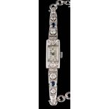 A lady's Art Deco sapphire and diamond cocktail wristwatch: the rectangular dial with Arabic