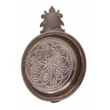 A George IV silver lemon strainer, no maker's mark, London, 1822: initialled, with beaded border,