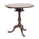 A George III mahogany circular tea table:,