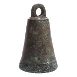 An Islamic bronze bell: of conical tapering form, with single band of scripted decoration, 25cm.