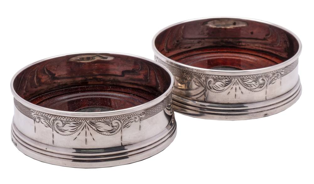 A pair of Elizabeth II silver bottle coasters, maker W Broadway & Co, Birmingham,