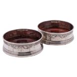 A pair of Elizabeth II silver bottle coasters, maker W Broadway & Co, Birmingham,