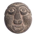 A Polynesian carved basalt stone head: probably Maquesas Islands or Hawaii, 20th century,