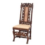 A 19th Century carved walnut dining chair in the Carolean taste:,