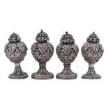 A set of four Indian white metal pepperettes,