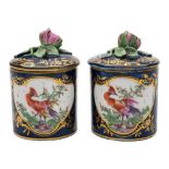 A pair of Derby toilet/pomade pots and covers: of cylindrical form with bud finials,