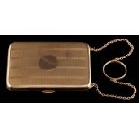 A 9ct gold rectangular cigarette case: with elastic retainer and on chain with carrying ring,