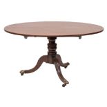 A Regency mahogany oval breakfast table:, the snap top with a reeded edge,