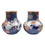 A pair of Japanese Fukugawa vases: of compressed globular form,