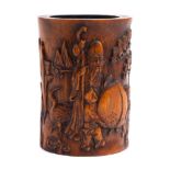 A Chinese 'Shoulao' bamboo brush pot: carved with Shoulao resting one hand on a giant peach