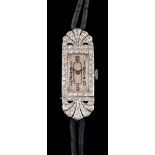 A lady's Art Deco platinum and diamond cocktail wristwatch: the rectangular dial with Arabic