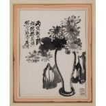 A Chinese painting of chrysanthemums arranged in a vase in the style of Shitao: in a garden with